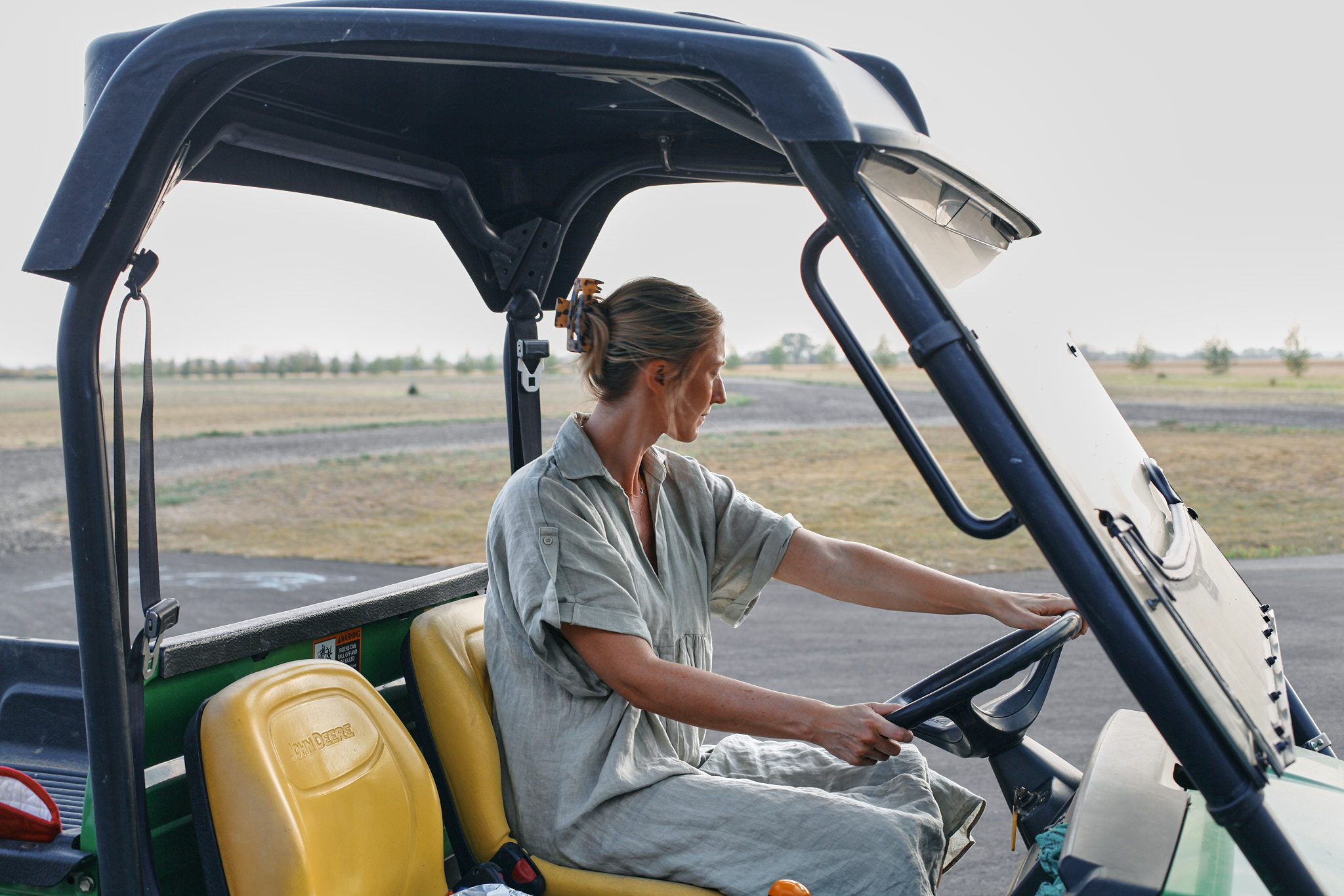 Farmer’s Shepherd Pie Edited 10 on the gator delivering supper to the field with the dogs running alongside