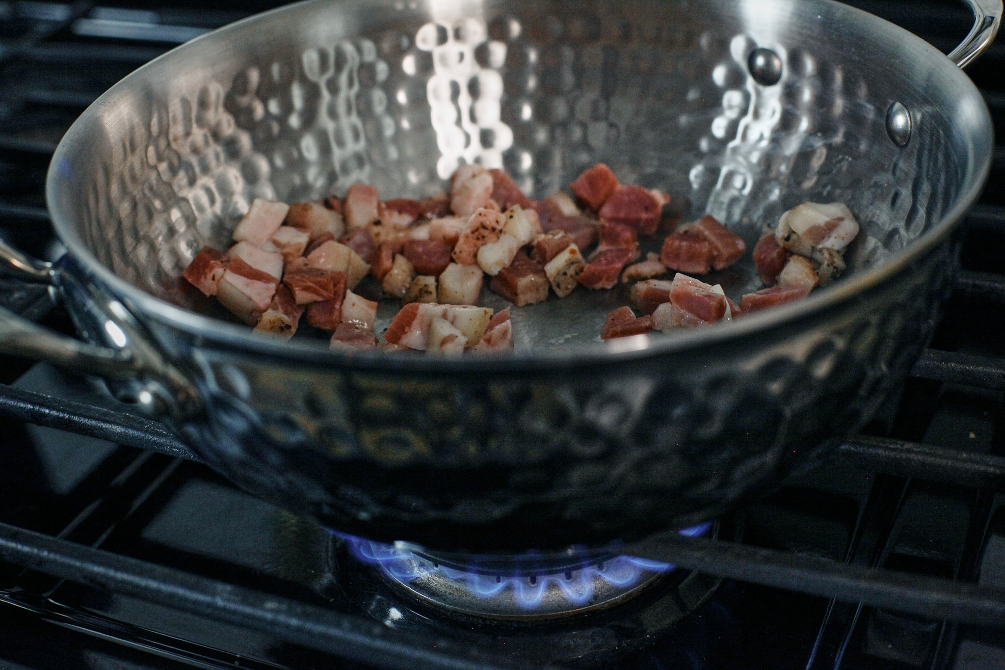 pancetta frying in the pan