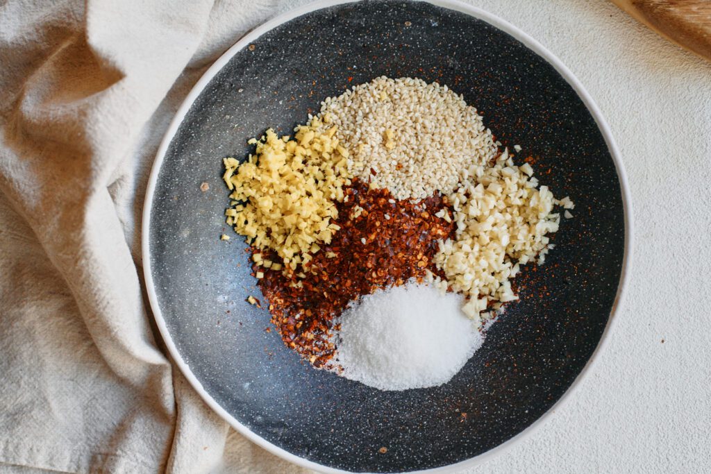 red chili flakes, sesame seeds and minced garlic, ginger and sugar