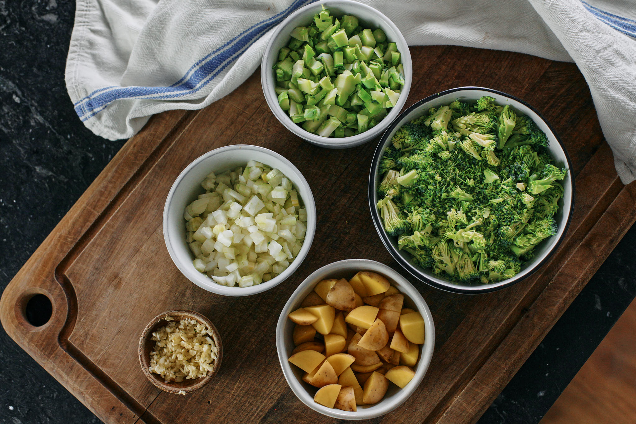 Broccoli Cheddar Soup prep for broccoli cheddar soup with shells - chopped broccoli, onion, potato, garlic