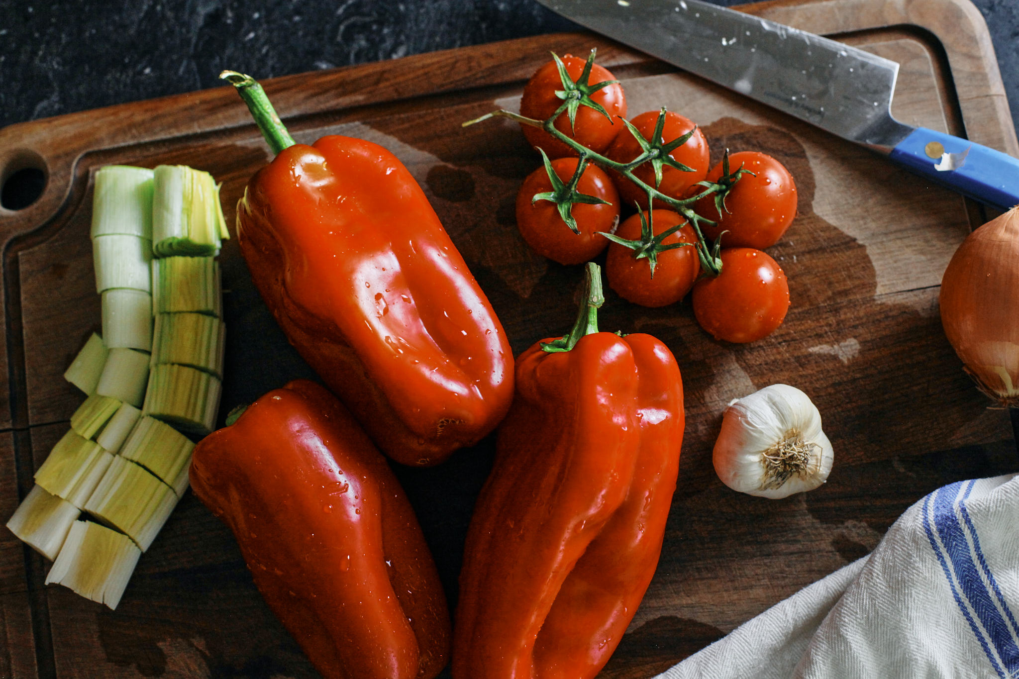 red peppers, leek, tomatoes, garlic and onion prep