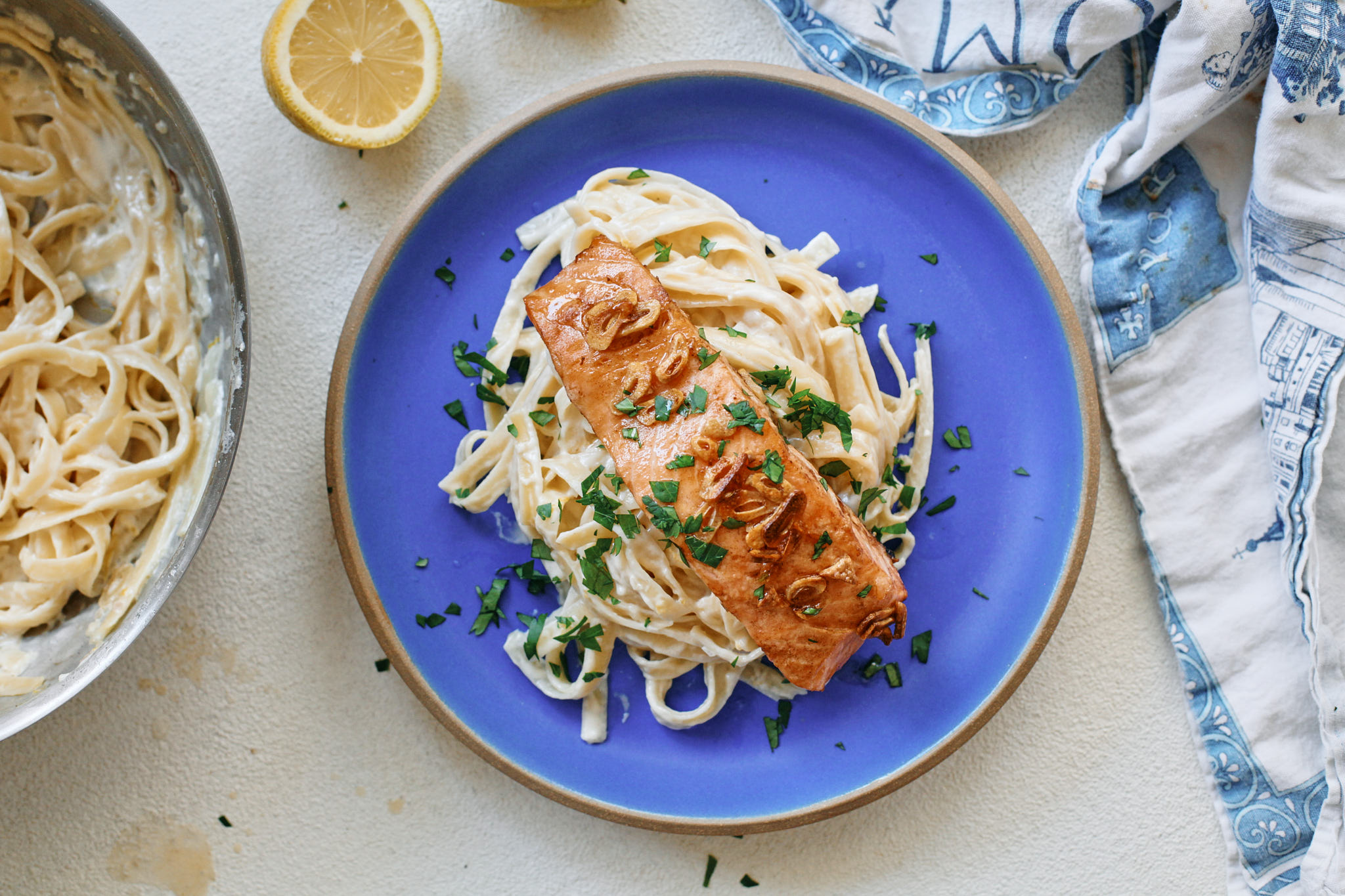 garlic butter salmon over creamy lemon pasta