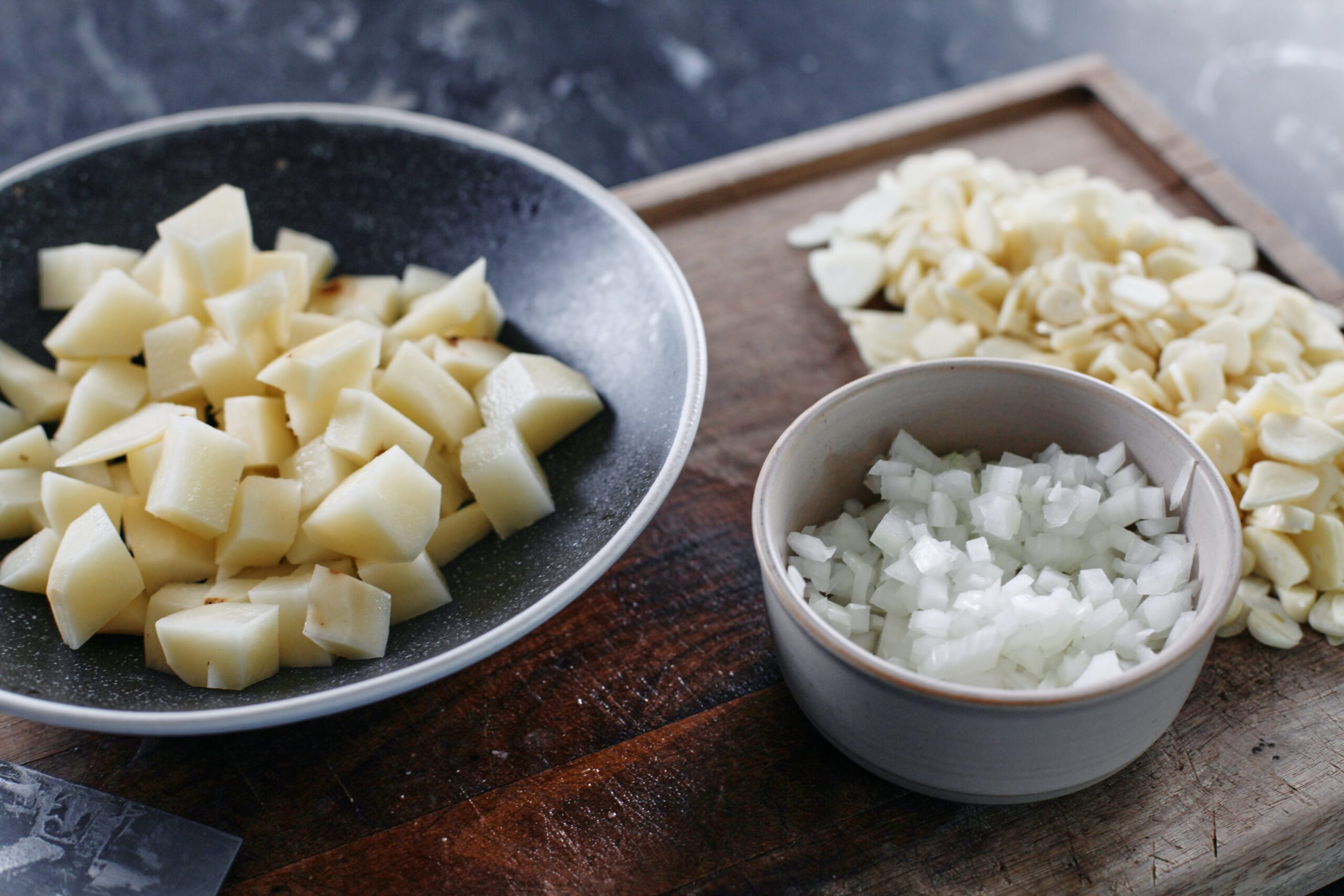 thinly sliced garlic, chopped onion, and chopped potato