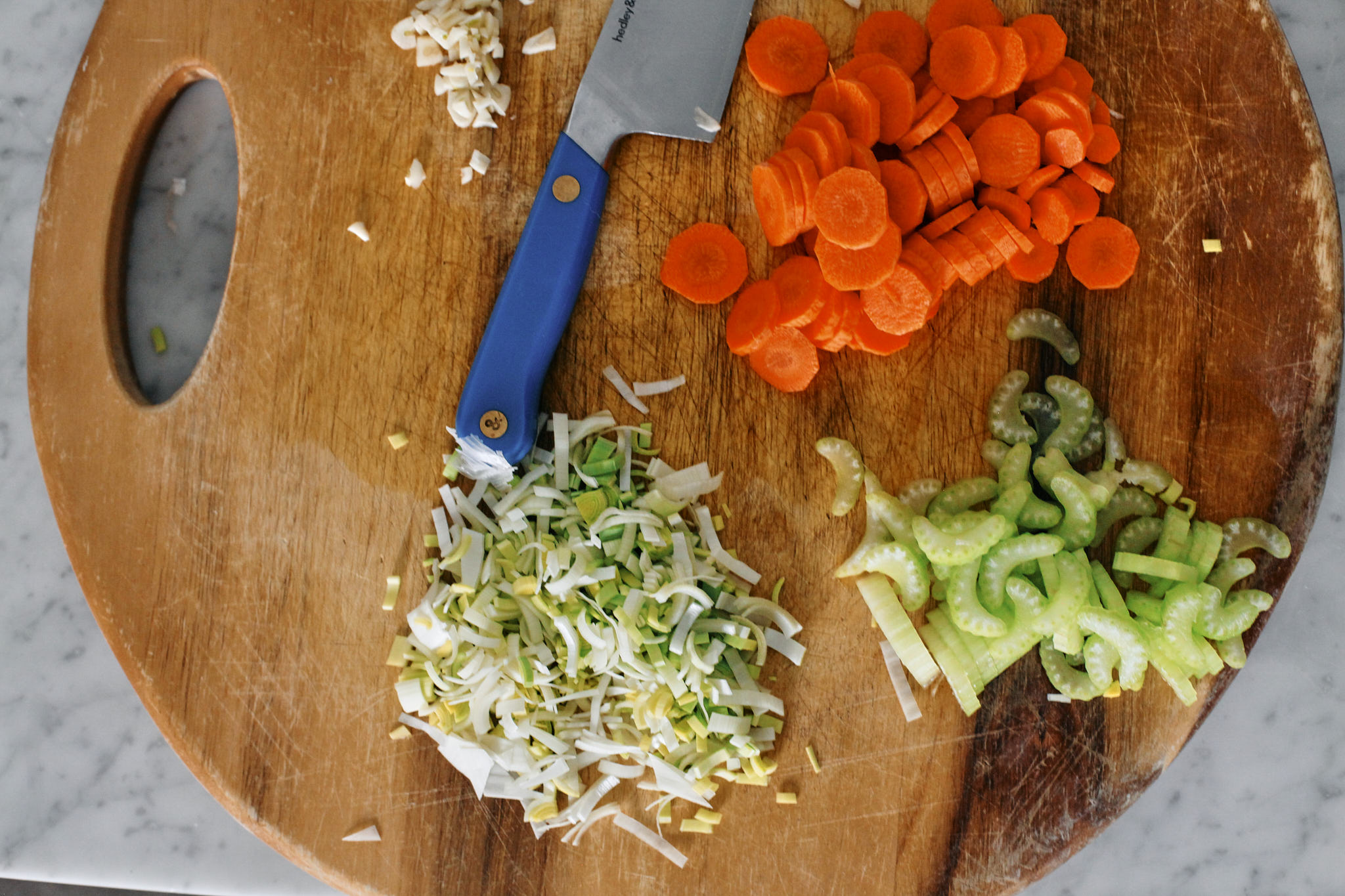Hearty Italian bean and orzo stew prep for the hearty Italian bean and orzo stew: chopped celery, carrots, leek and garlic.