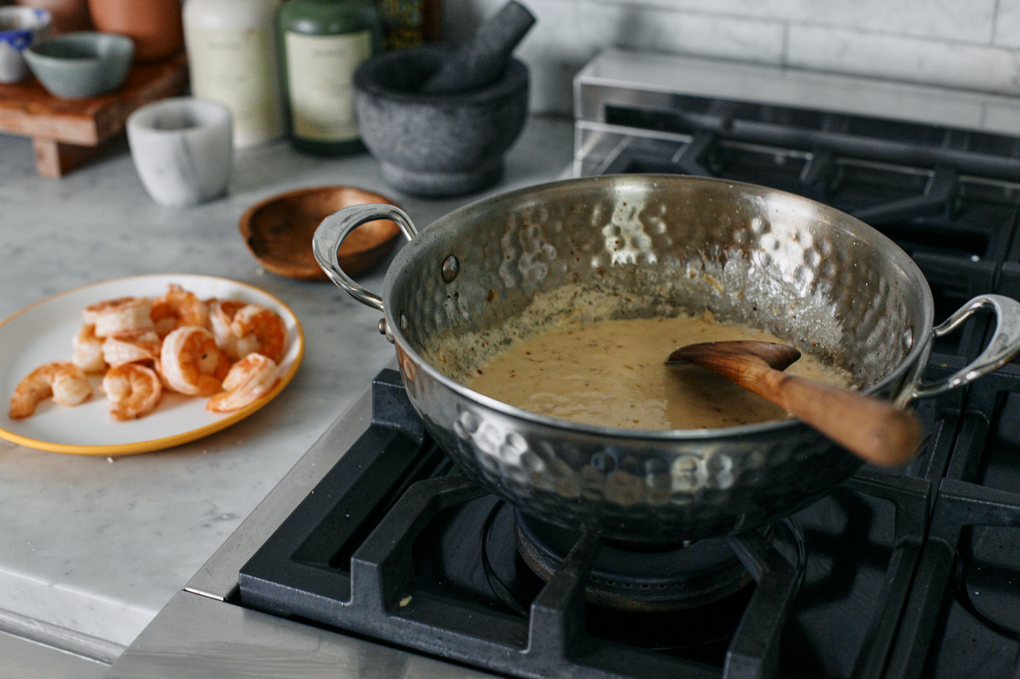 building the creamy sauce for creamy lemon pasta with shrimp