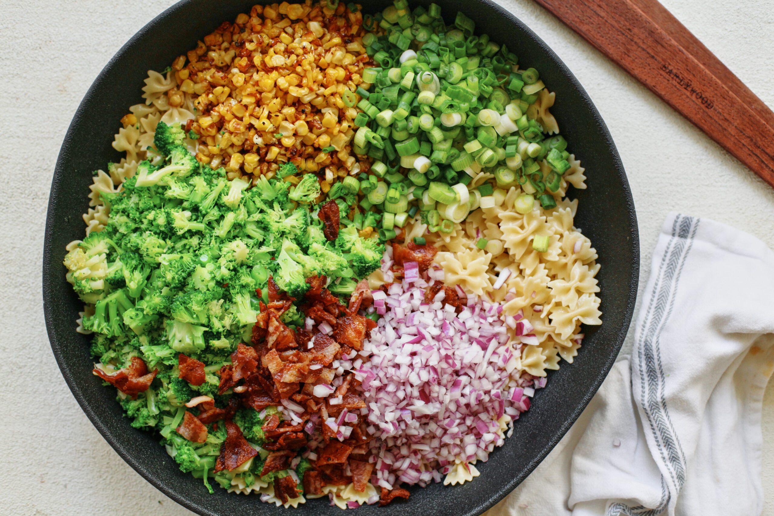Roasted corn pasta salad with bacon, broccoli, boursin and herbs