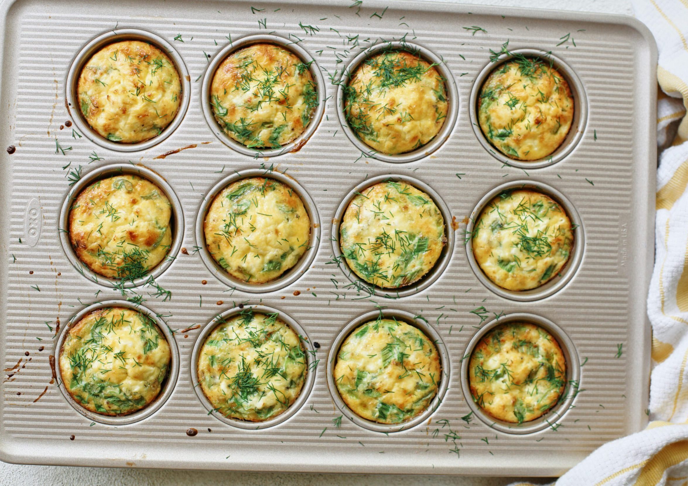 baked mini spring frittata bites, topped with fresh dill