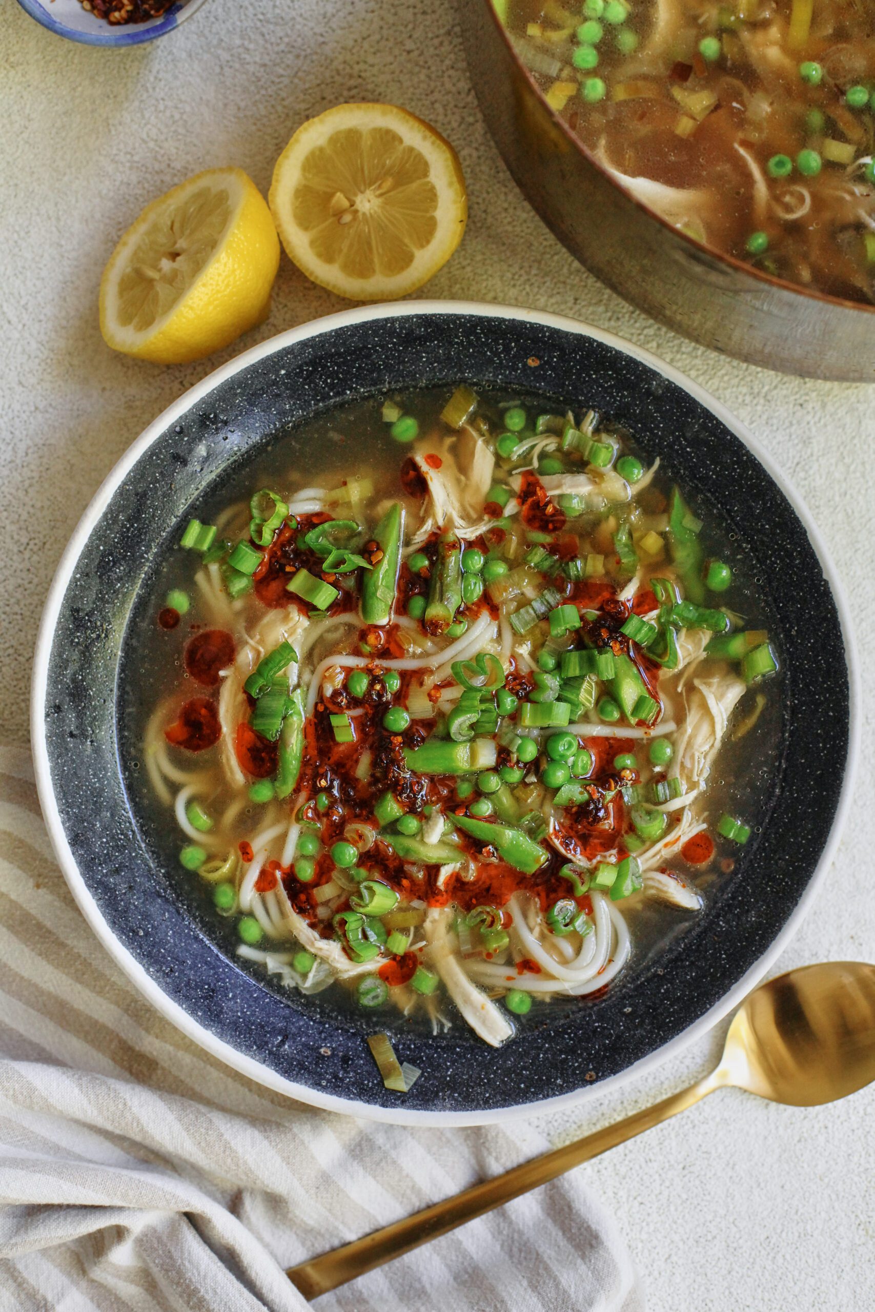 spring ginger chicken noodle soup with aunt lily's chili oil on top