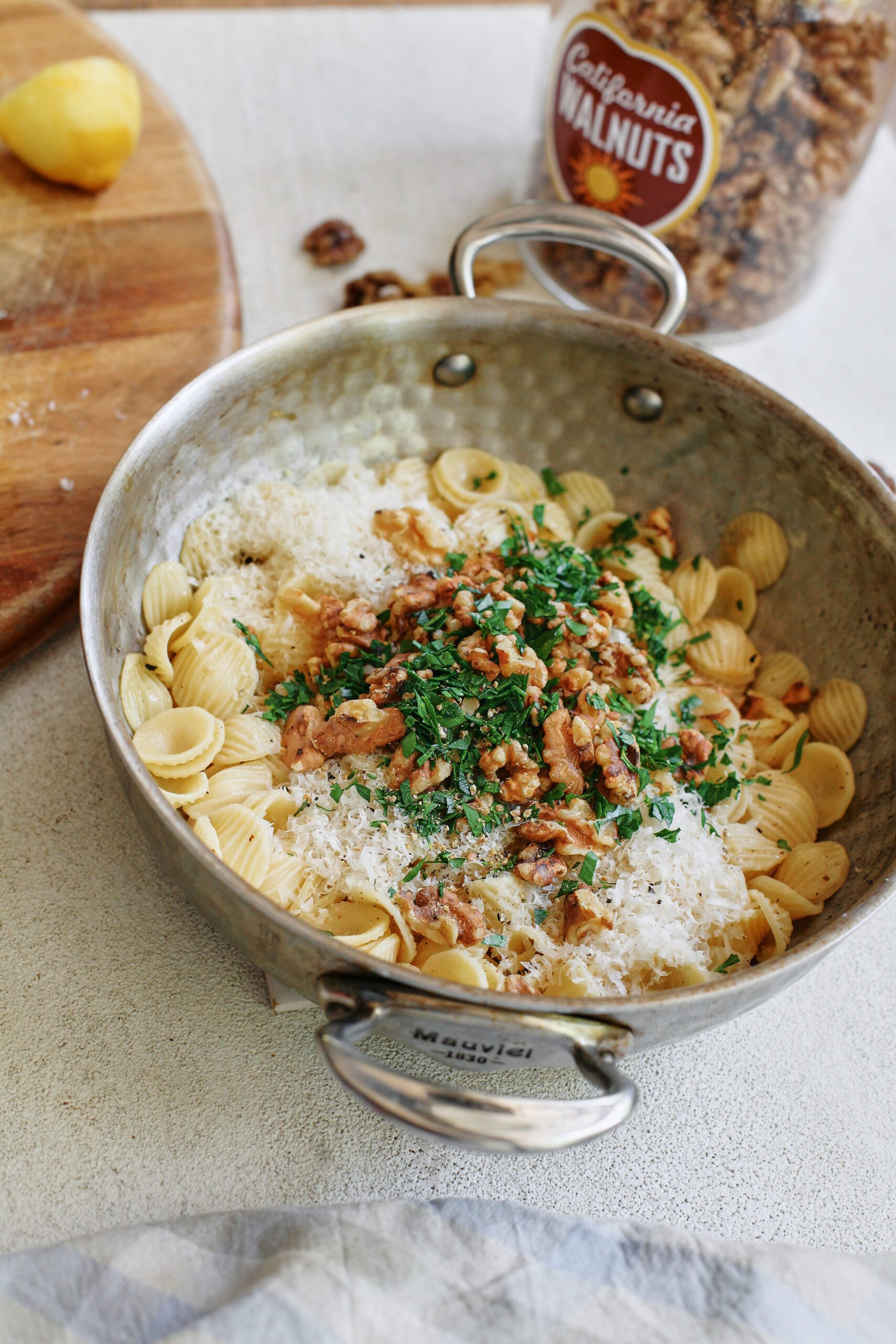 brown butter walnut pasta with parmesan, walnuts, and fresh parsley, before being mixed together