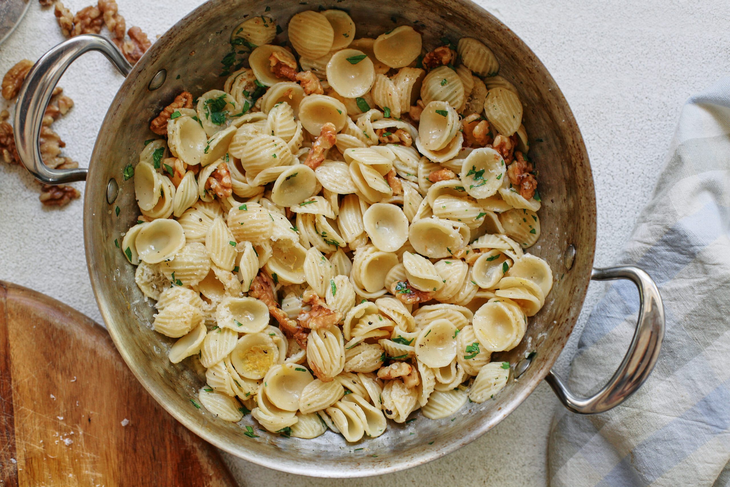 brown butter walnut pasta in a pan after being combined