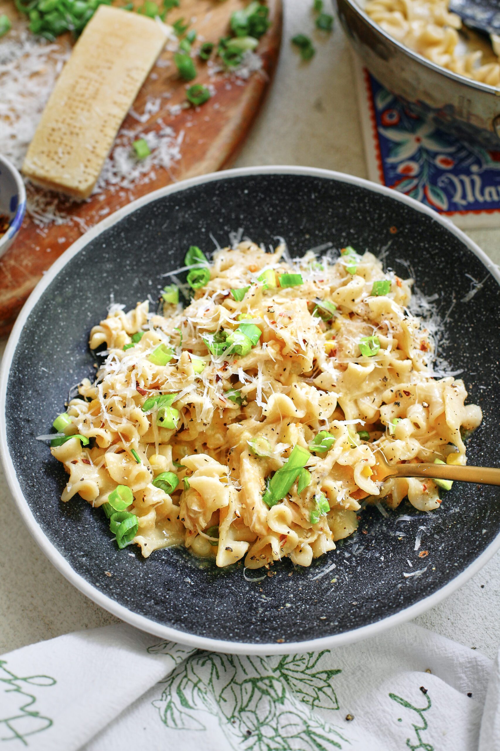 Creamy Corn and Chicken Pasta 15 creamy corn and chicken pasta in a charcoal-coloured bowl with a gold fork