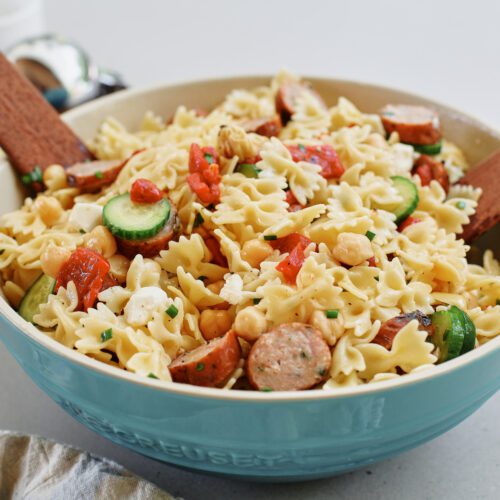 high protein pasta salad in a large bowl, tossed to combine