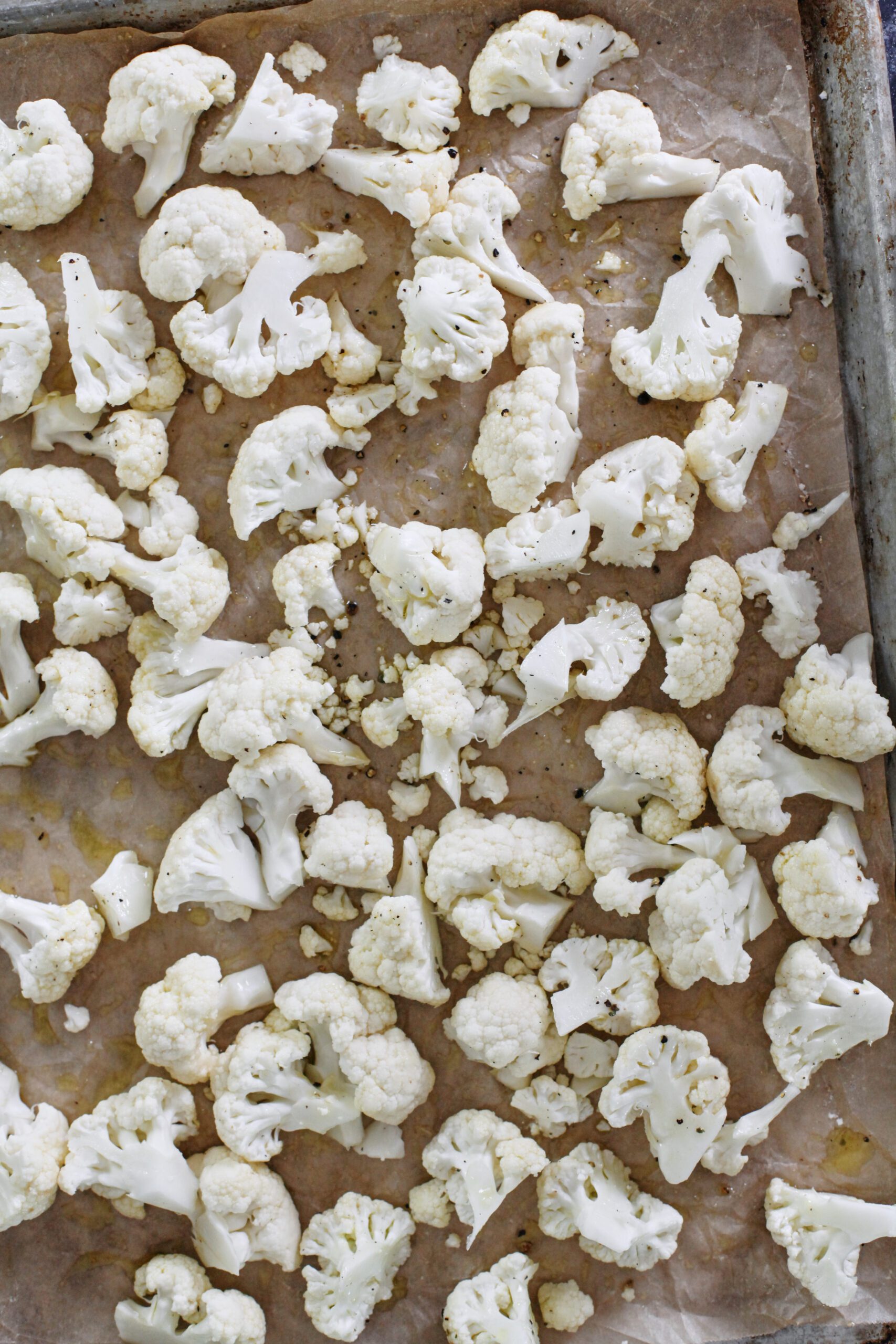Salt and Vinegar Cauliflower 1 chopped cauliflower on a parchment lined pan