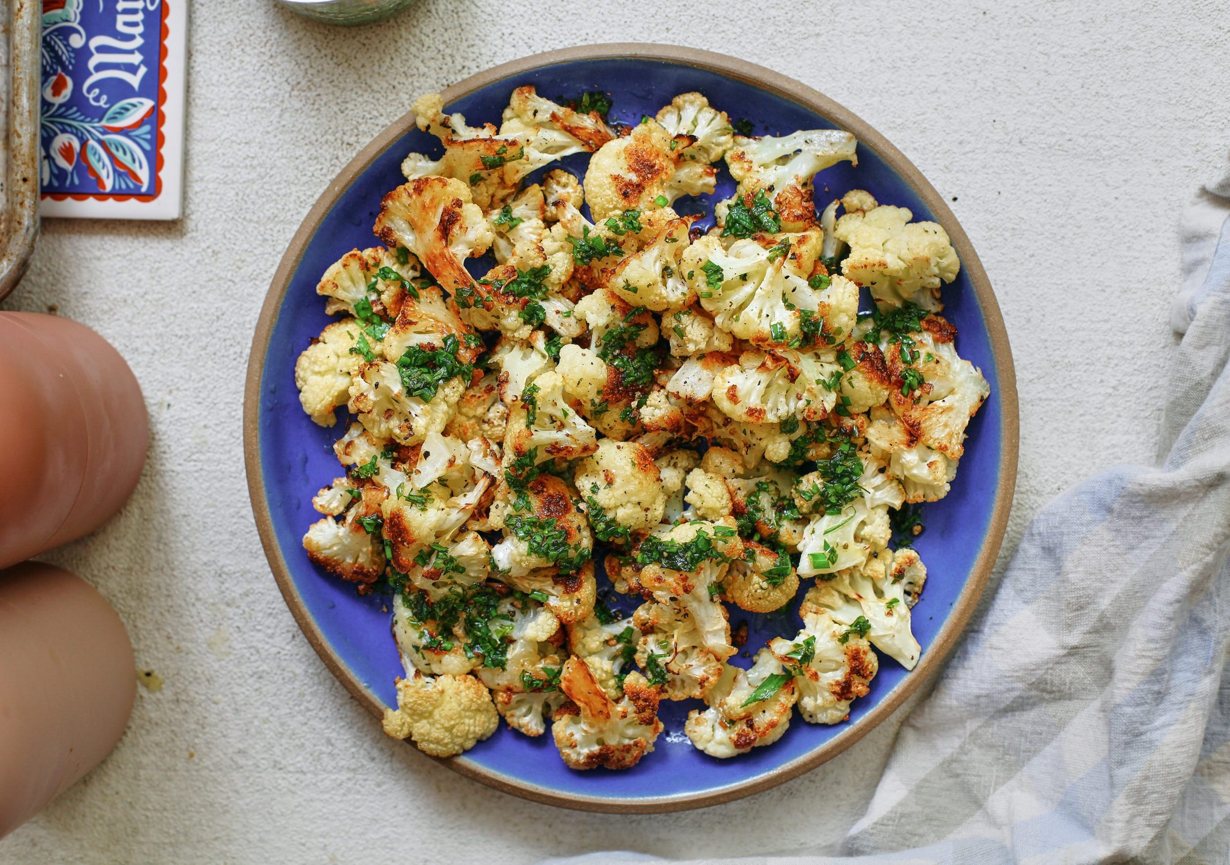 salt and vinegar cauliflower on a blue plate
