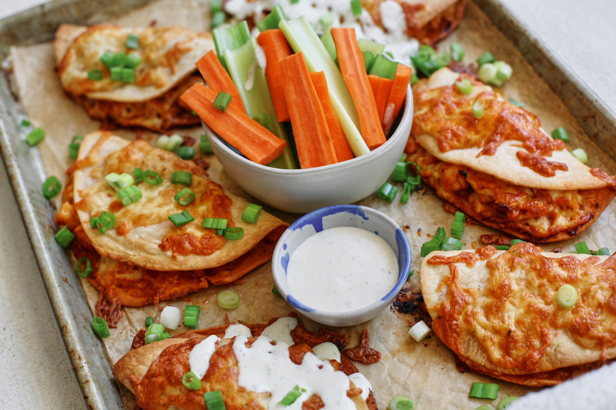 buffalo chicken sheet pan tacos with homemade ranch dressing and celery and carrot sticks