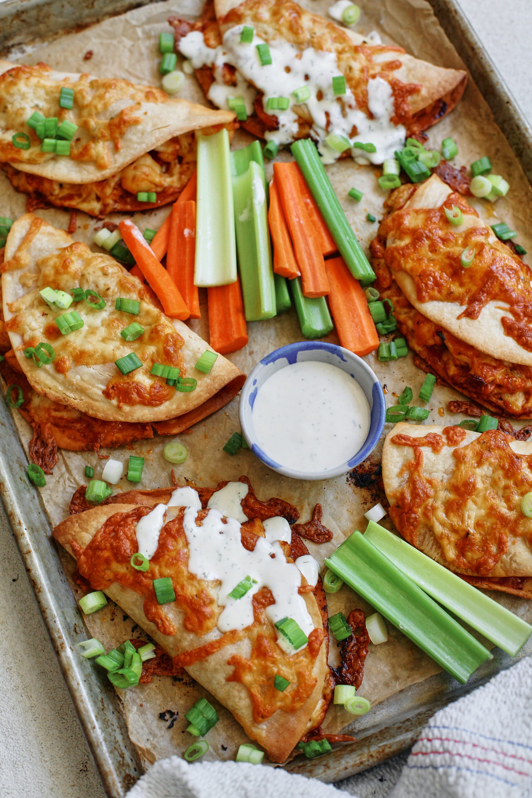 buffalo chicken sheet pan tacos with homemade ranch dressing and celery and carrot sticks