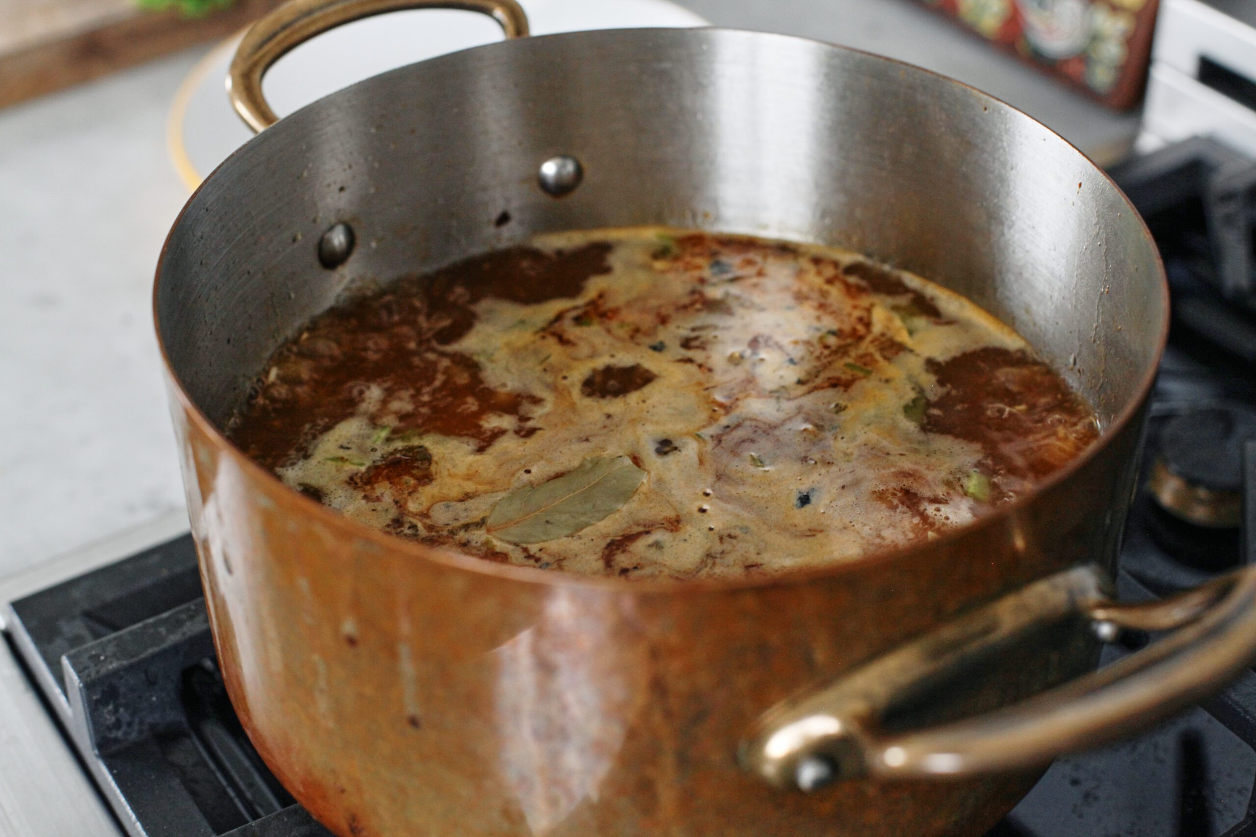 soup in a large pot cooking on the stove