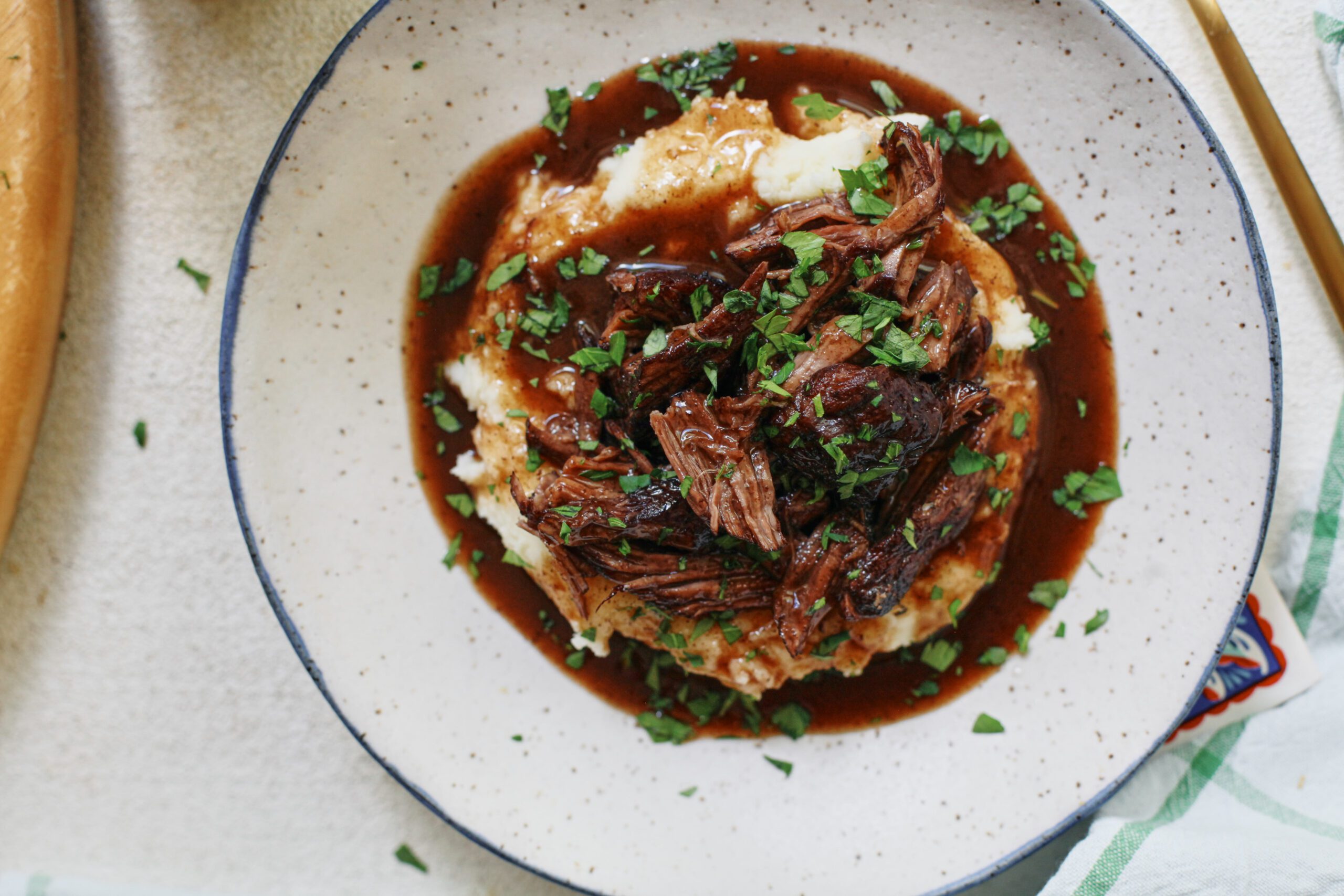 braised beef over mashed potatoes