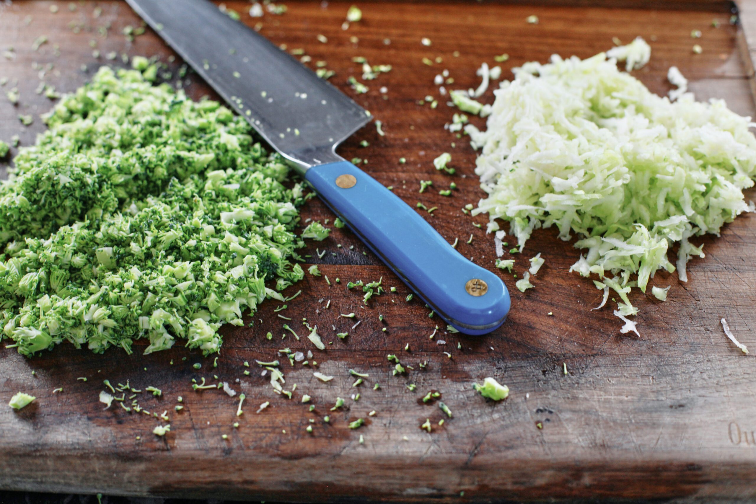 prep for the broccoli cheddar mac and cheese - grated broccoli stems and finely chopped broccoli florets