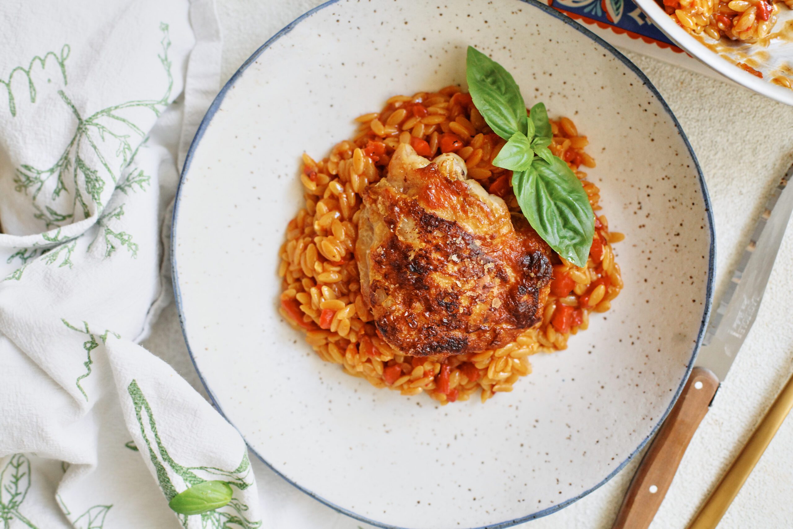 crispy chicken thighs with roasted red pepper orzo
