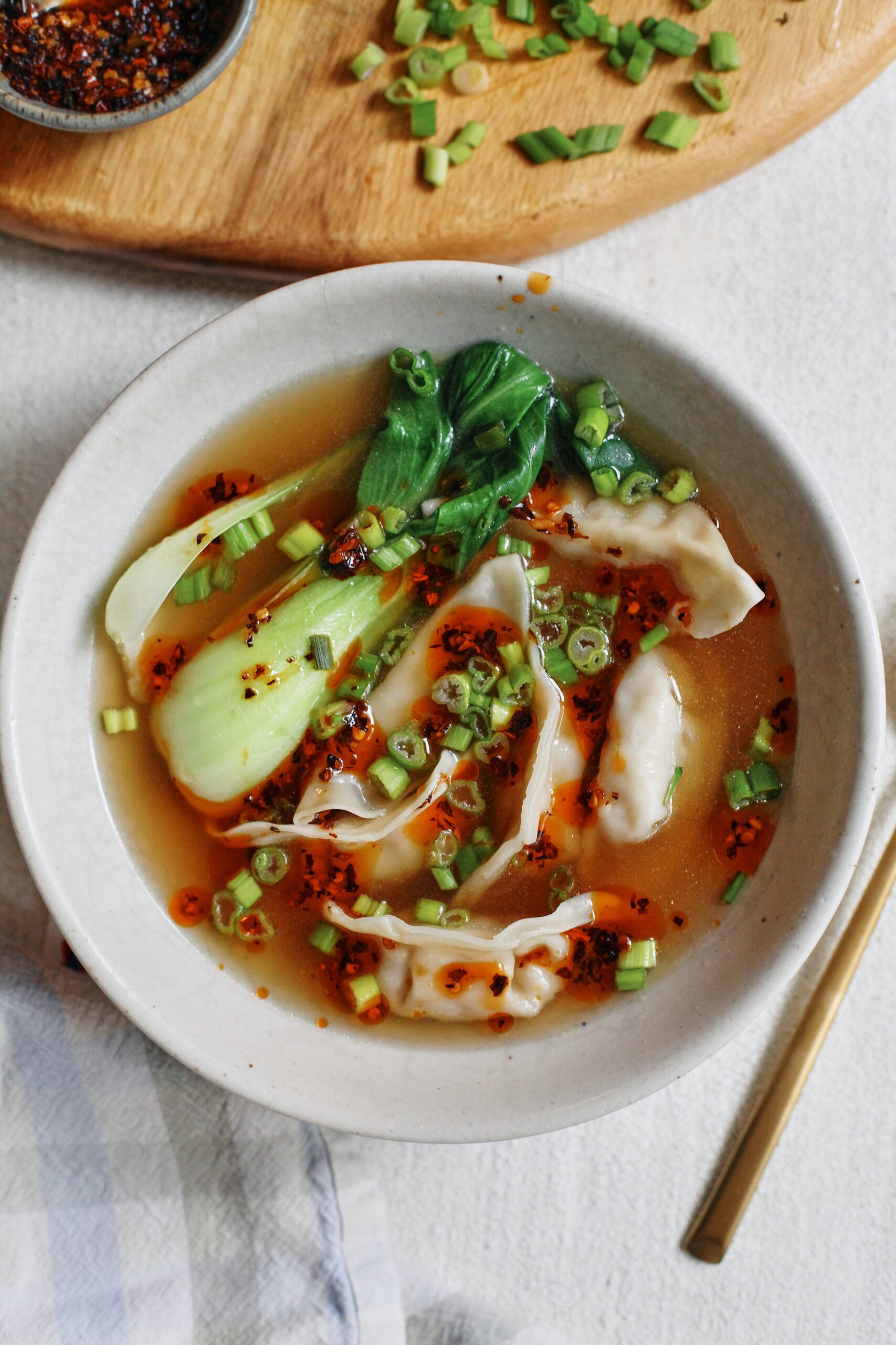 brothy dumpling soup with baby bok choy