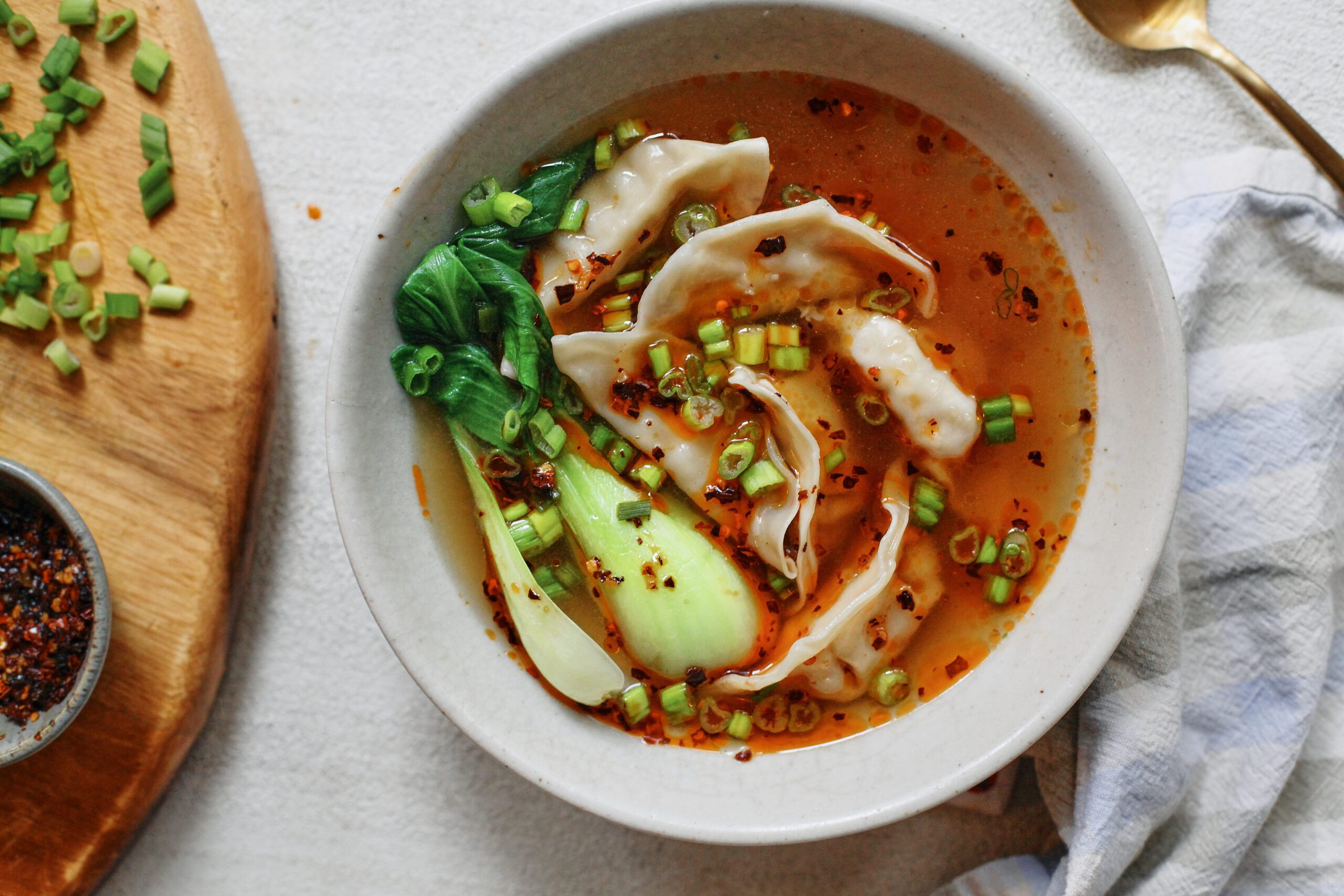 brothy dumpling soup with baby bok choy