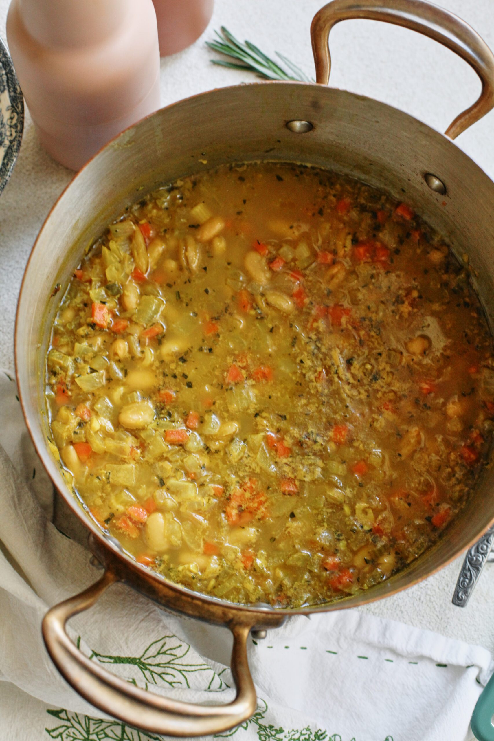 overhead photo of pasta e fagioli alla bianca in a large pot